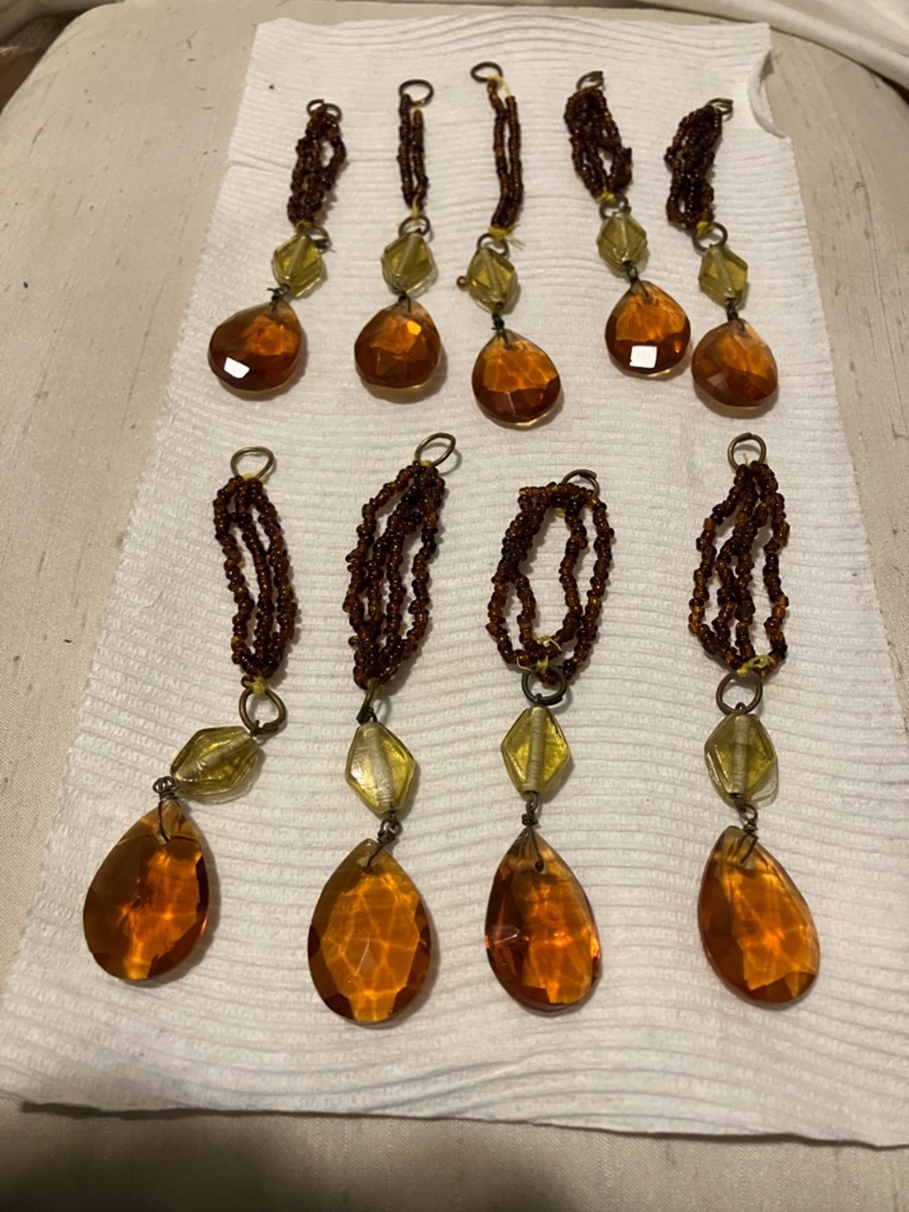 Amber n Citron hanging glass , teardrop shape pieces. Each around 4”